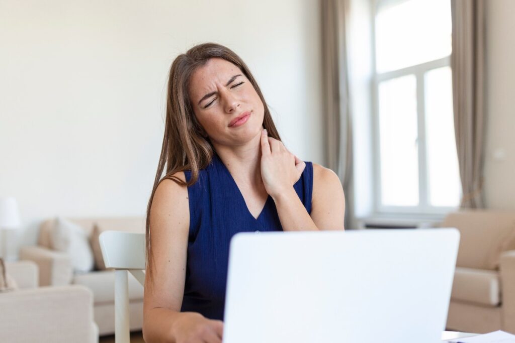 young-businesswoman-suffering-from-neckache-massaging-her-neck-while-sitting-her-working-place-home-office_edited